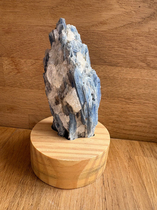 Kyanite and quartz freeform on wooden stand