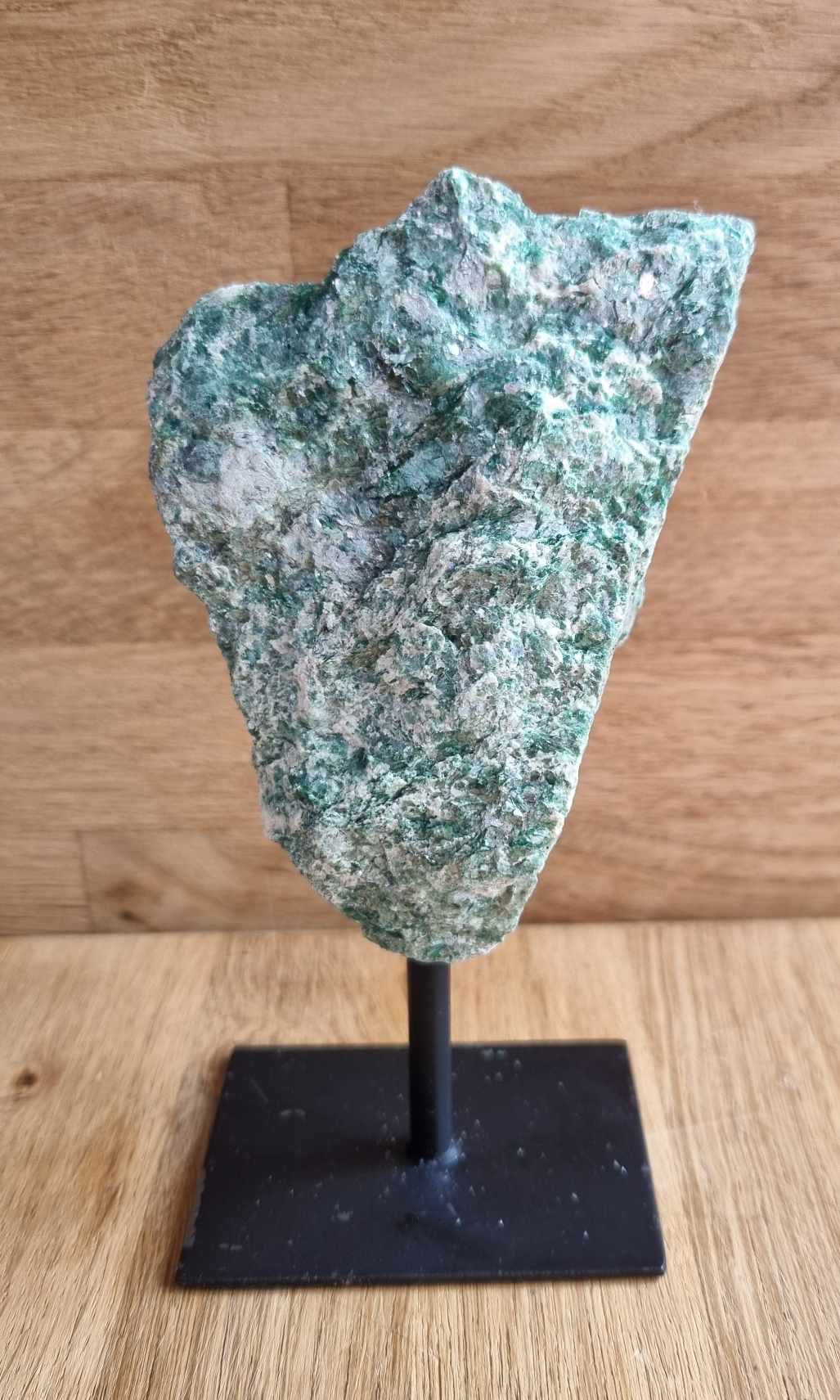 Raw fuchsite on stand