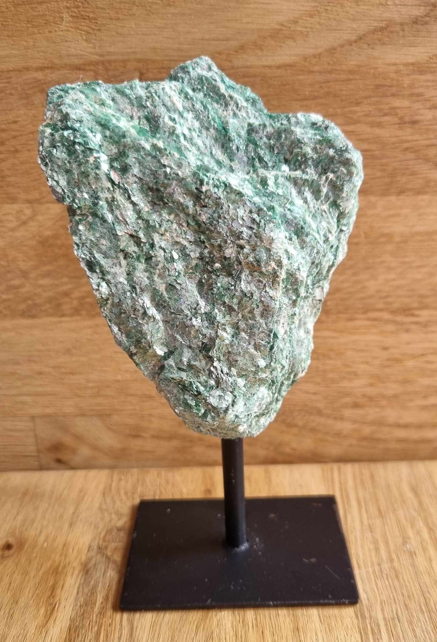 Raw fuchsite on stand