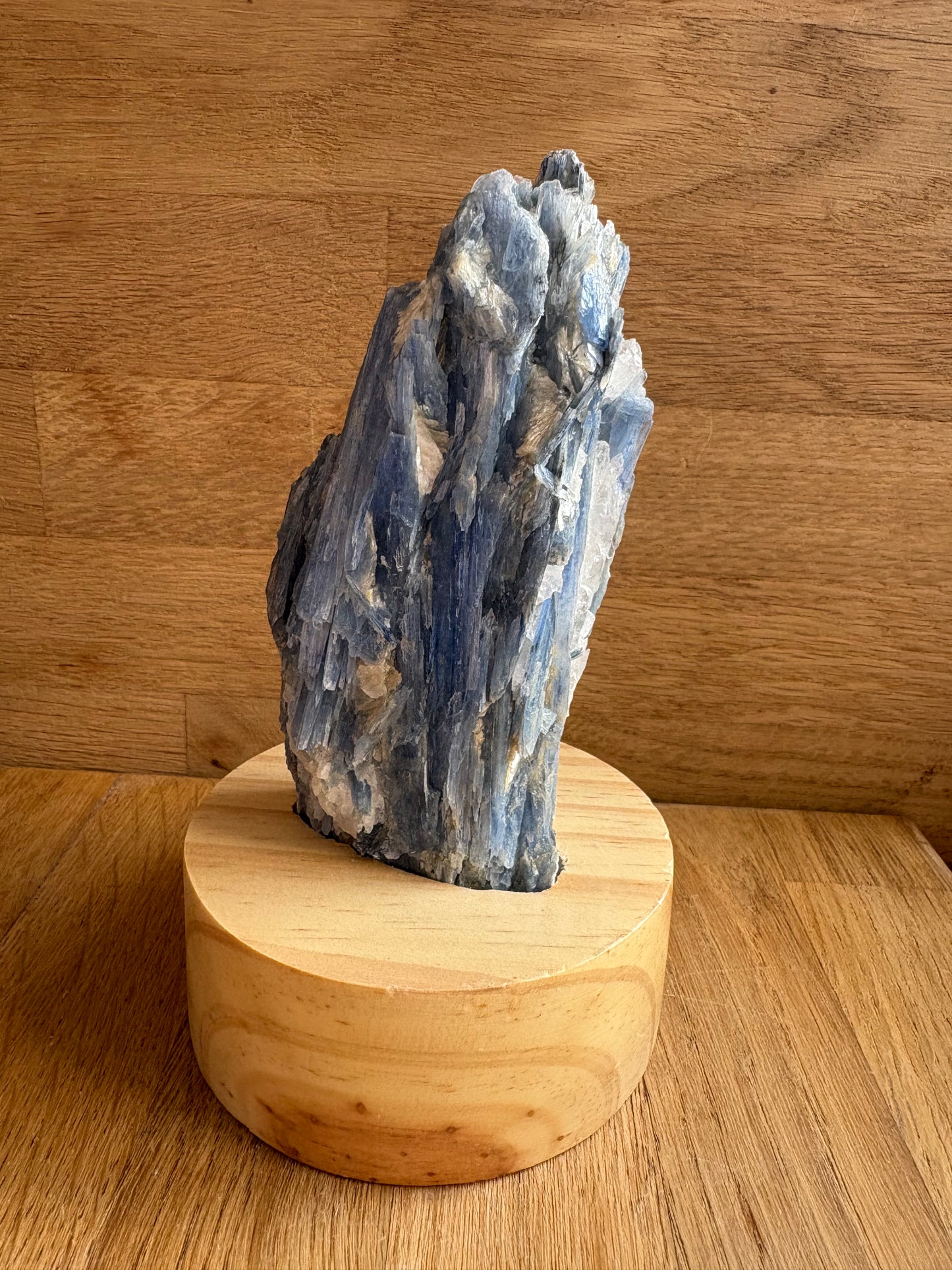 Kyanite and quartz freeform on wooden stand