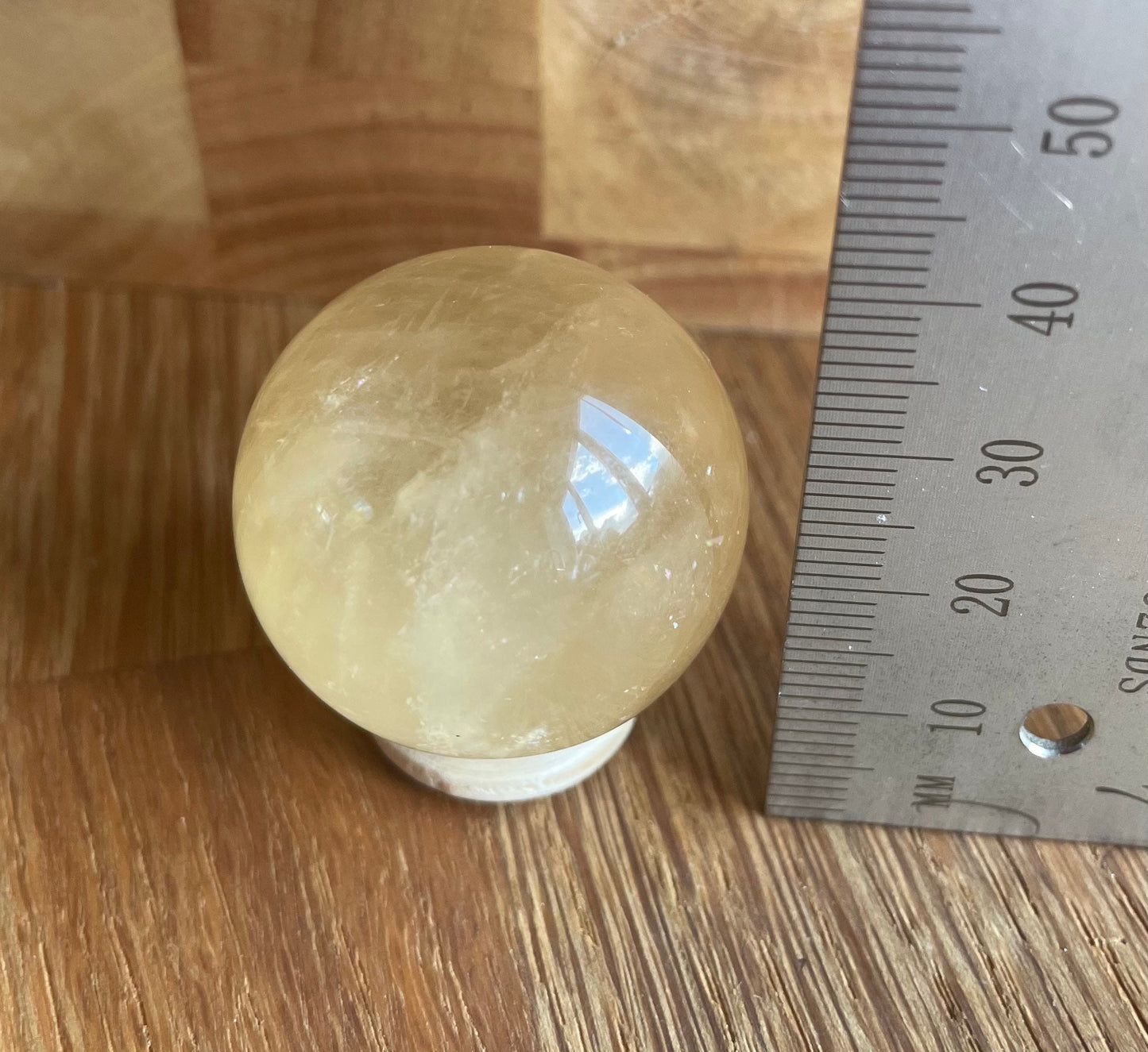 Orange calcite sphere, 3.2cm