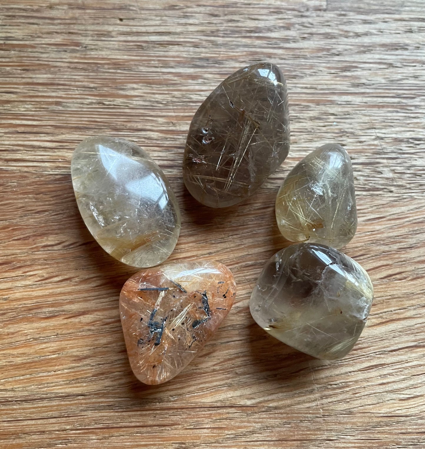 Rutilated quartz tumble stone